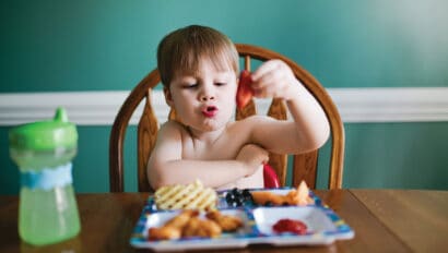 child eating at a table.