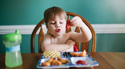 child eating at a table.
