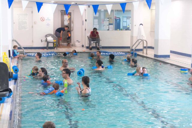 people in an indoor pool.